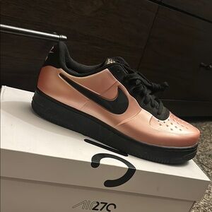 Nike Pink and Black Sneakers with Leather Upper and Perforations